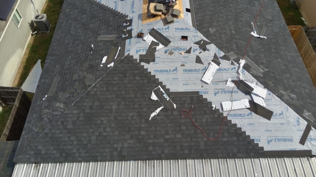 Tear-off of a hail-damaged roof in Austin