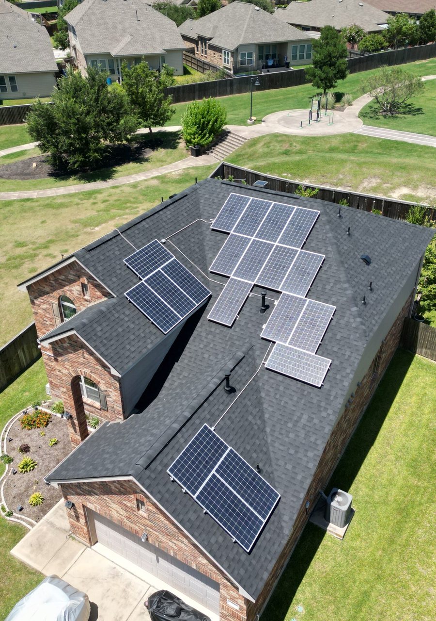 Ronald's new black IKO roof with solar panels reset, Buda TX